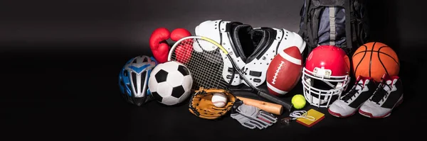 Close-up Of Various Sport Equipment Isolated On Black Background