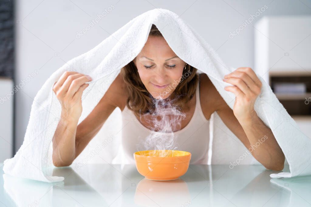 Woman Doing Inhalation Alternative Herbal Medicine Using Steam Bowl