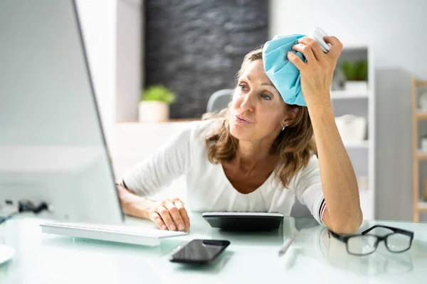 Young Woman Suffering Headache Applying Icepack — Stockfoto