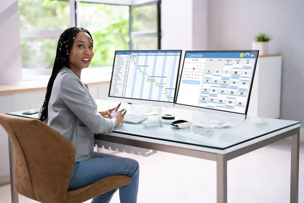 Business Woman Using Calendar Agenda Schedule On Computer Screen