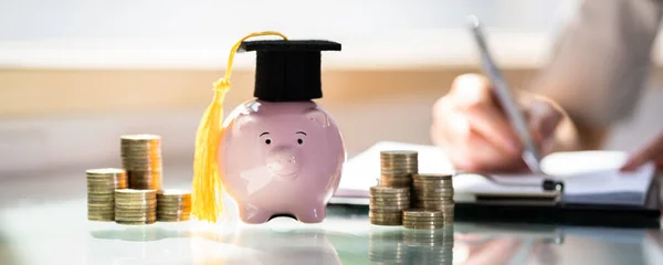 Stacked Coins Piggy Bank Graduation Cap Front Businesswoman — 图库照片