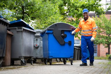 Garbage Removal Man Doing Trash And Rubbish Collection clipart