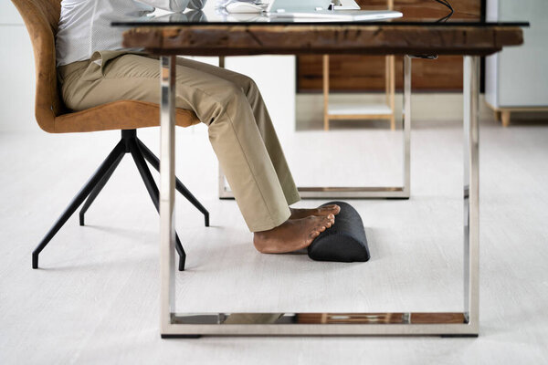 Footrest Against Pain In Office. Shifting Posture And Positions