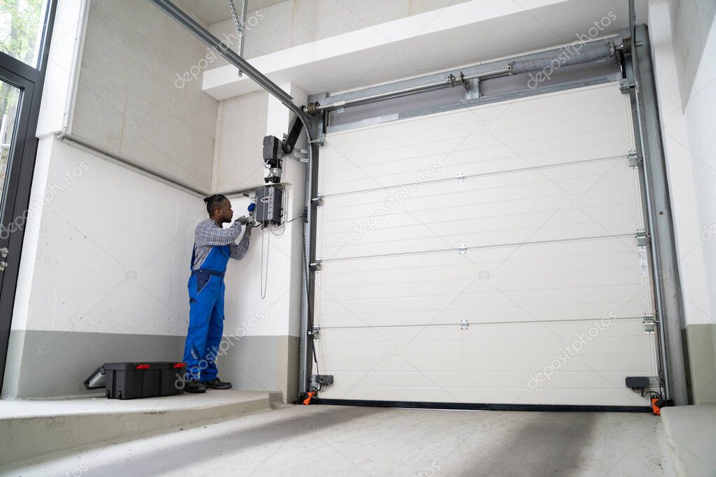 Installing Automatic Garage Door Or Gate. Maintenance And Repair