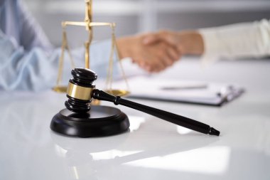 Lawyer Client Handshake In Courtroom. Justice And Law