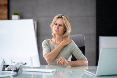 Posture Fatigue Shoulder Pain. Mature Woman At Computer Workstation