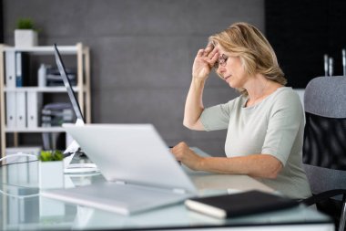 Unhappy Sad Business Woman. Stress And Headache Using Computer