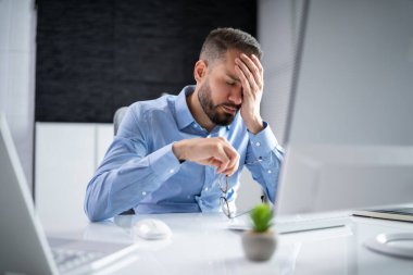 Stressed Sick Employee Man At Computer In Office