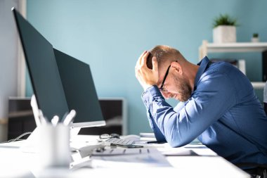 Stressed Sick Employee Man At Computer With Pain