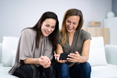 Women At Home Doing Ecommerce Online Shopping On Mobile Phone