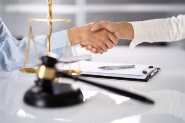 Lawyer Client Handshake In Courtroom. Justice And Law