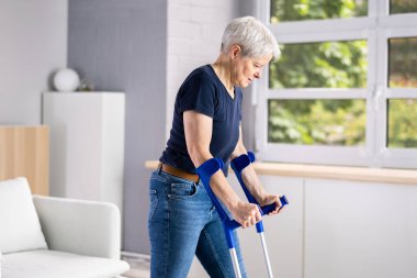 Woman With Broken Leg After Accident Using Crutches