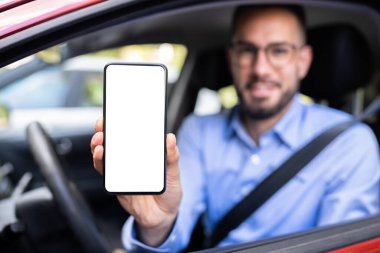 Man Hand Showing Mobile Phone In Car
