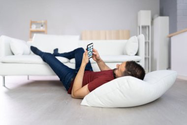 Man With Lethargy And Fatigue On Couch Or Sofa