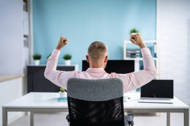 Happy Business Man With New Job Using Business Computer