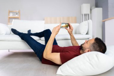 Man With Lethargy And Fatigue On Couch Or Sofa