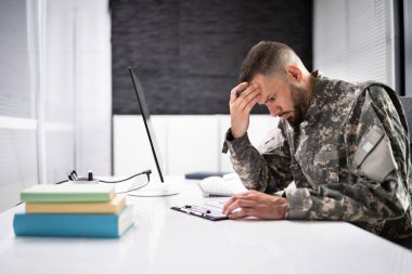 Sad Frustrated Military Veteran Student Doing Test In College