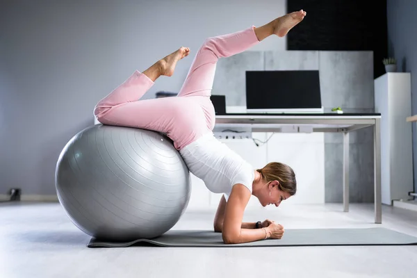 Exercise Workout With Fitness Ball At Office Desk