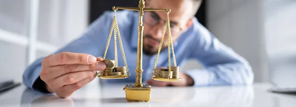 Money On Justice Scale. Lawyer Balancing Wealth