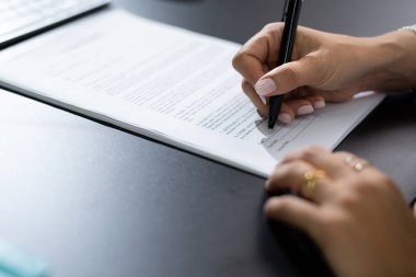 Woman Filling Business Contract Form Close Up