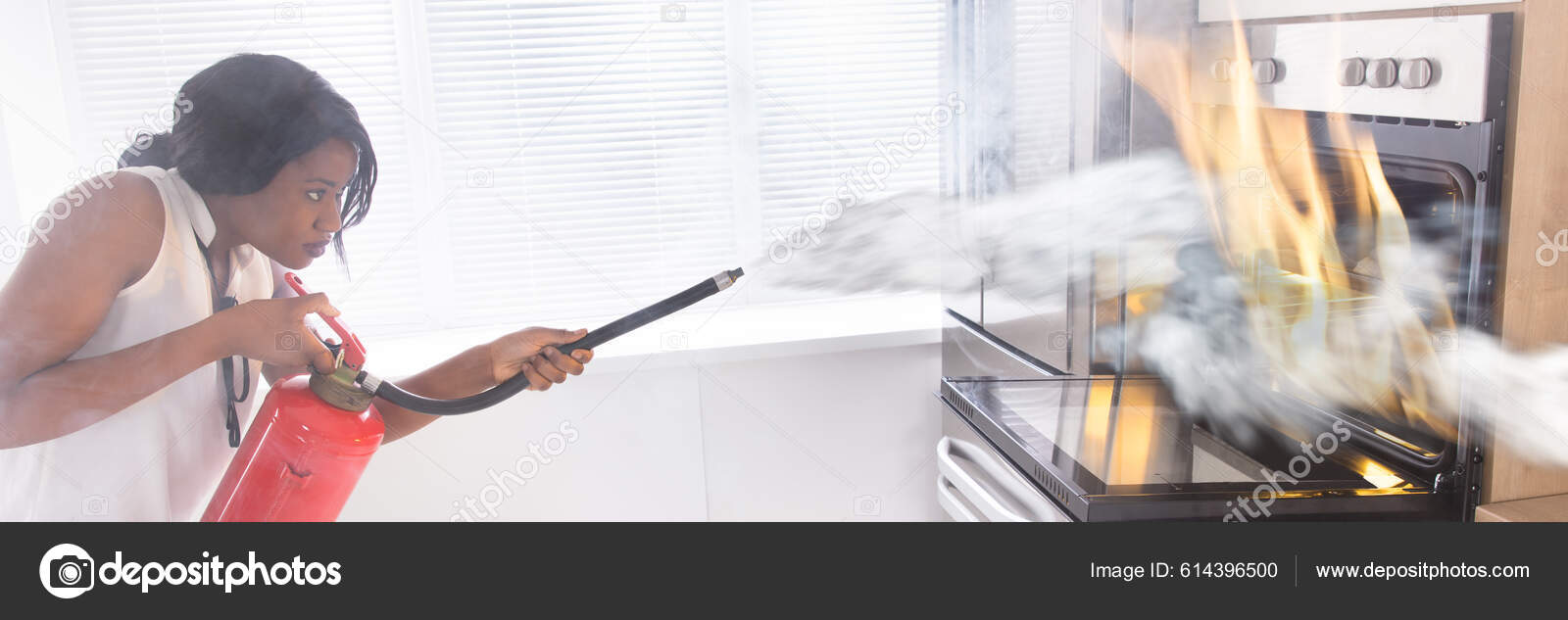 Using Fire Extinguisher Kitchen Oven Safety Disaster Stock Photo by