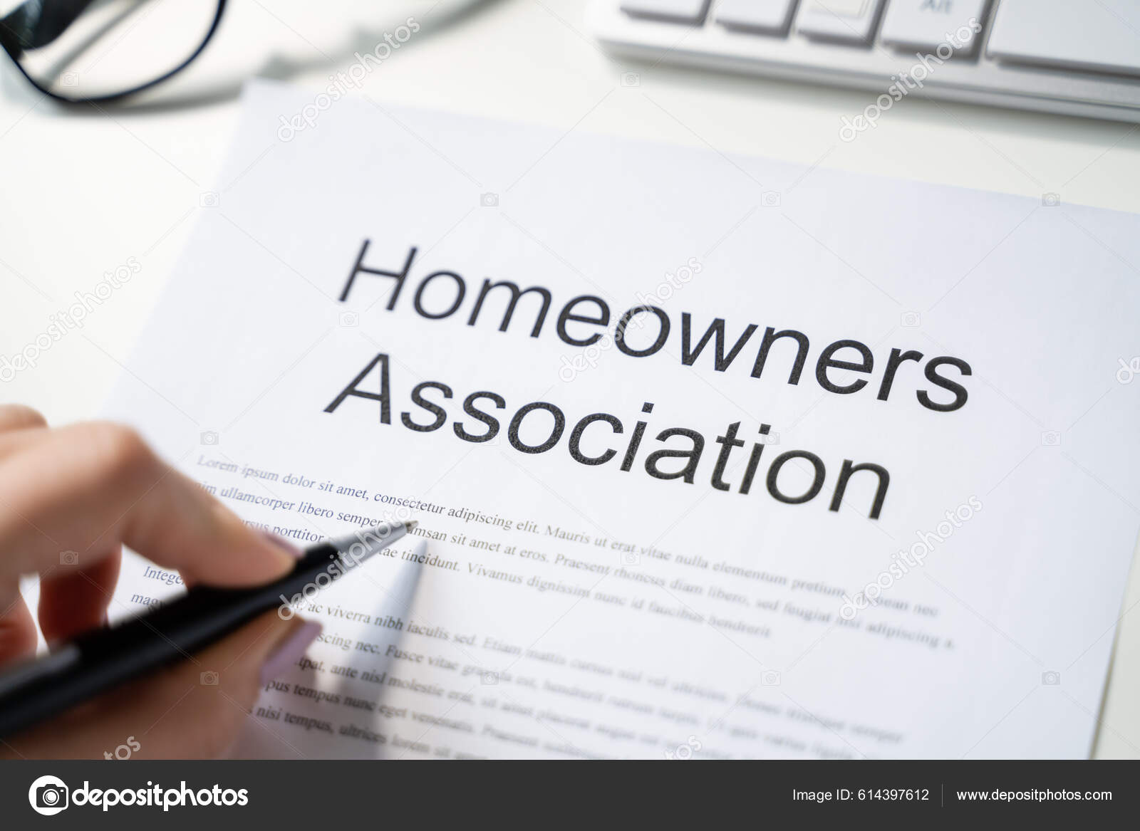 Person Reading Hoa Rules Regulations Document Stock Photo by