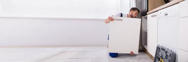 Carpenter Installing Kitchen Furniture Maintenance Fixing — Stock Photo, Image