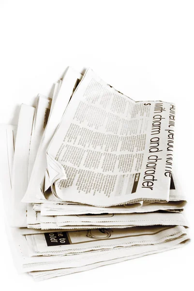 Stack of newspapers isolated Stock Image