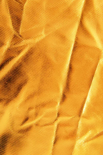 Gyllene skrynkliga tyg textur — Stockfoto