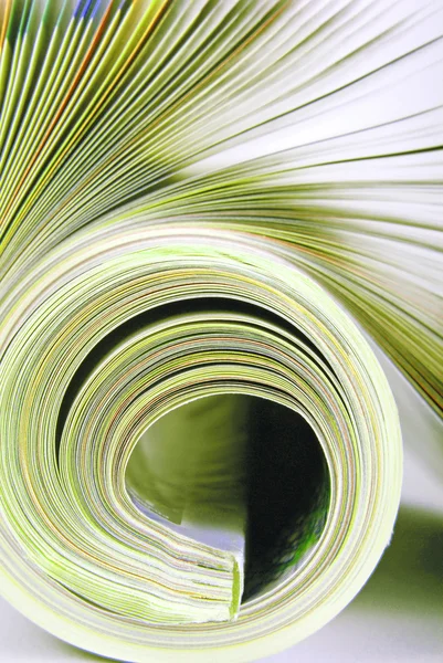 Rolled magazine macro — Stock Photo, Image