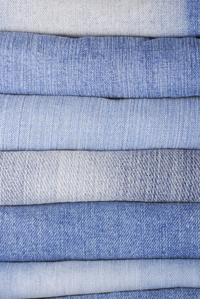 Stack of various jeans — Stock Photo, Image