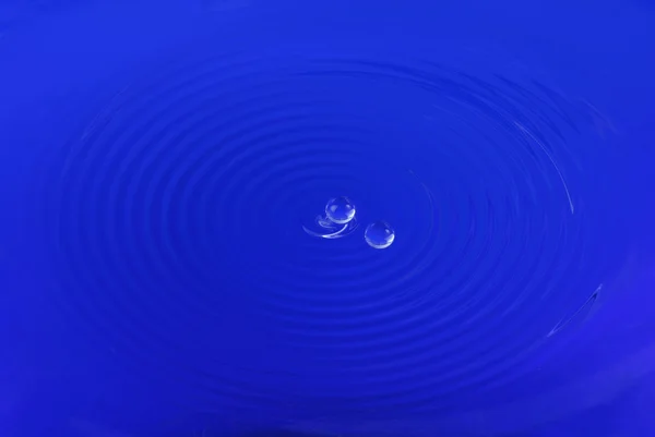 Drops on ripple water — Stock Photo, Image