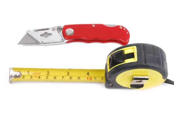 Measure meter and carpet knife — Stock Photo, Image