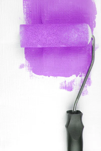 Paint roller decorating wall — Stock Photo, Image