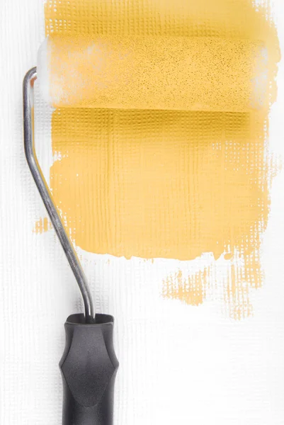 Paint roller decorating wall — Stock Photo, Image