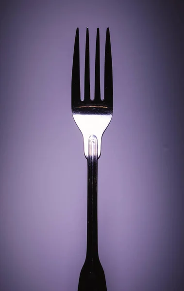 Closeup View One Metal Fork Purple Background Minimalistic Approach Studio — Stock Photo, Image