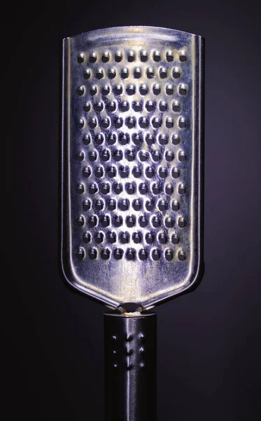 Closeup View One Metal Grater Purple Background Minimalistic Approach Studio — Stock Photo, Image