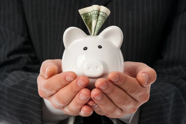 Holding piggy bank — Stock Photo, Image