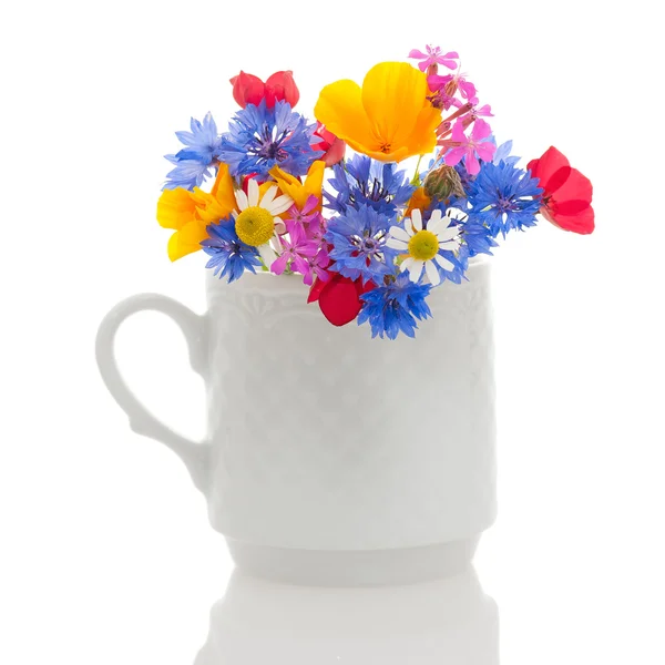 Wildflowers in cup — Stock Photo, Image