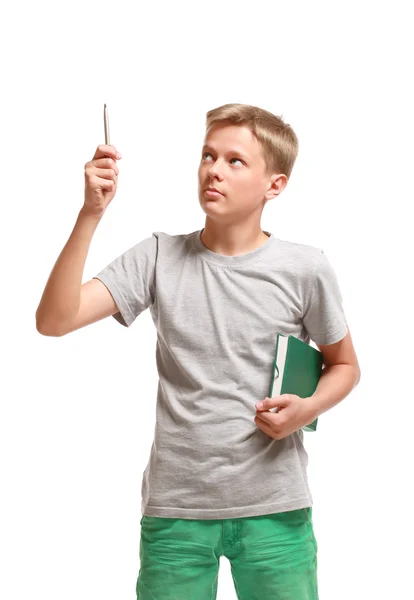 Teenage boy with a notepad points up — Stock Photo, Image