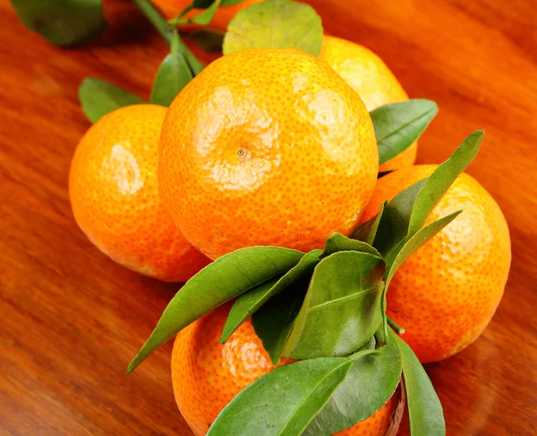 Mandarin on wooden background — Stock Photo, Image