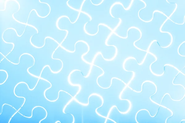 Puzzel in blauw licht — Stockfoto