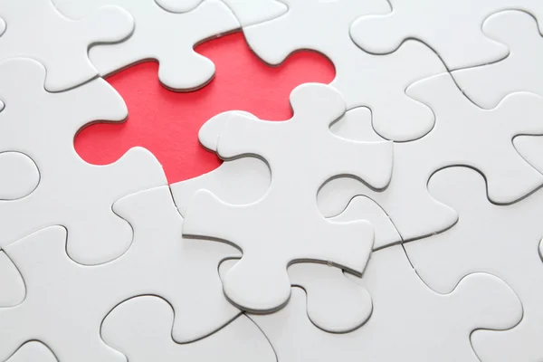 Puzzle with missing red piece — Stock Photo, Image