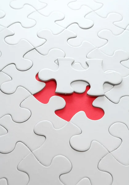 Puzzle with missing red piece — Stock Photo, Image