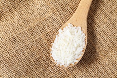 Rice with wooden spoon
