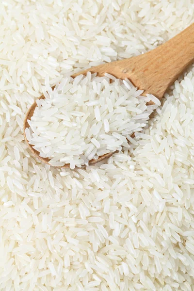 Rice with wooden spoon — Stock Photo, Image