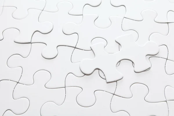 Białe puzzle układanki — Zdjęcie stockowe