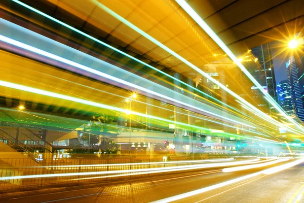 Moving car with blur light through city at night Royalty Free Stock Photos