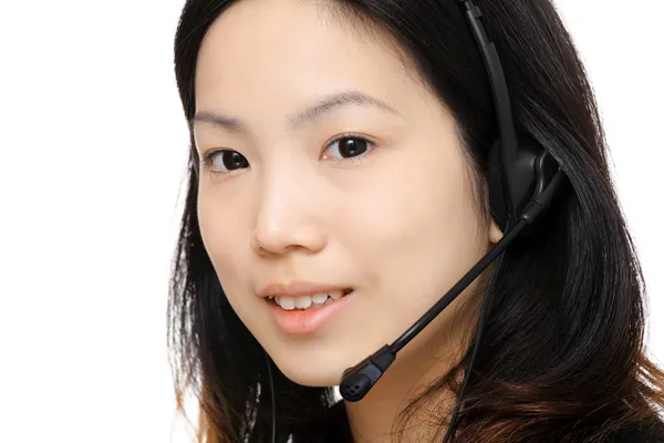 Asiatico donna assistente indossare auricolare — Foto Stock