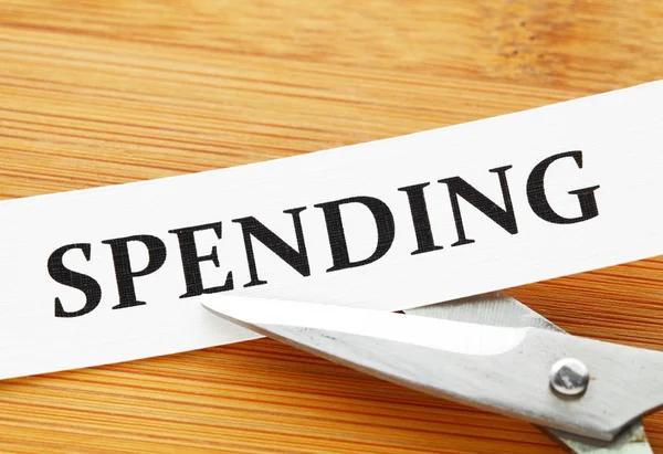 Scissors cut spending — Stock Photo, Image